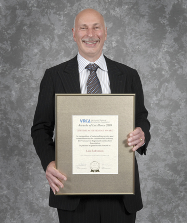 Photo of Len Robinson holding VRCA's Lifetime Achievement Award